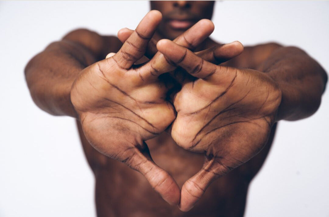 Man stretching his muscular arms