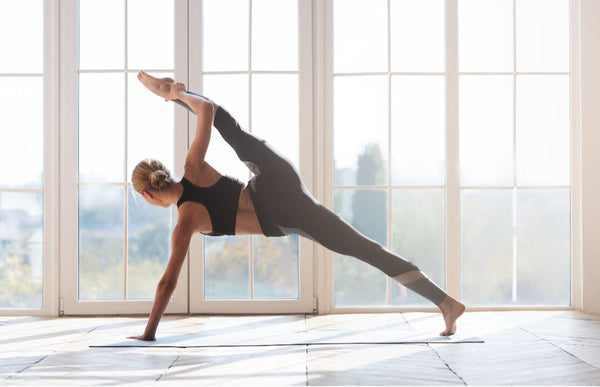 Woman doing split in yoga pose