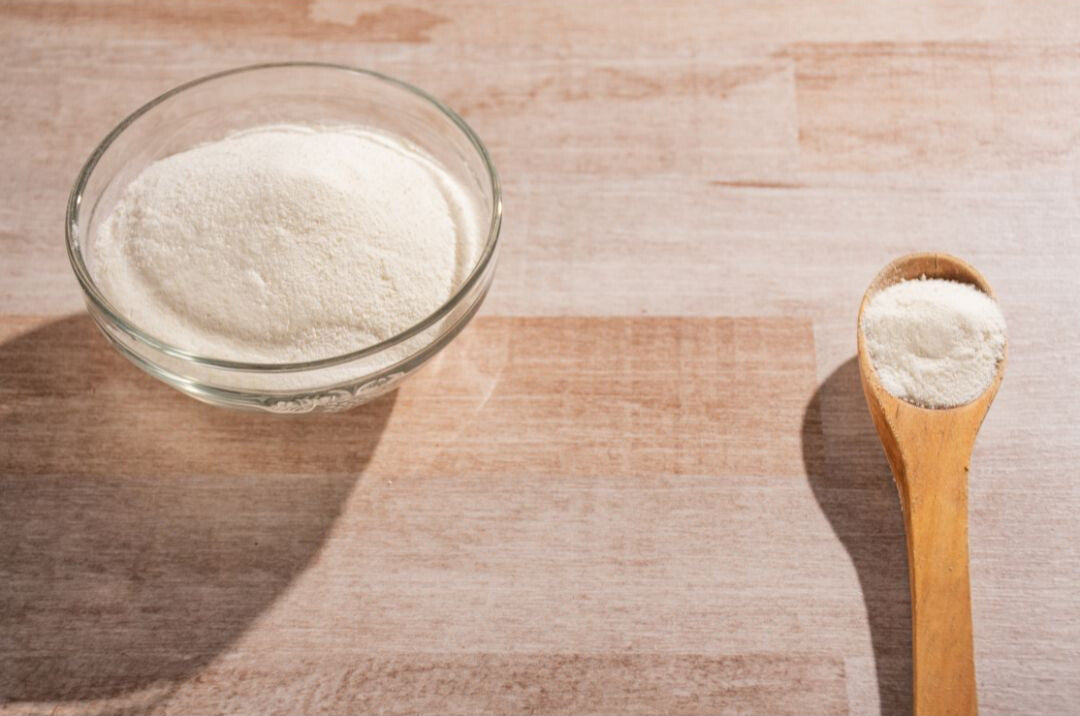 protein powder in bowl and spoon